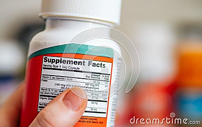 Supplement Facts on jar of multivitamin complex Stock Photo