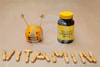 Supplements jar and a vitamin sign created from vitamin pills Stock Photo