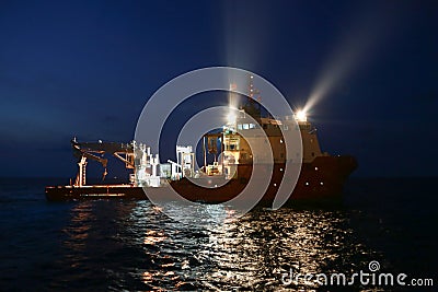 Supply boat operation shipping any cargo or basket to offshore. Support transfer any cargo to offshore oil and gas industry Stock Photo