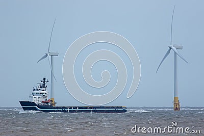 Supply vessel for green energy industry offshore wind turbine development Stock Photo