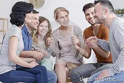 Support group praying Stock Photo