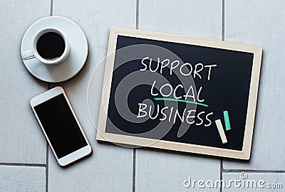 Support Local Business text written on blackboard Stock Photo