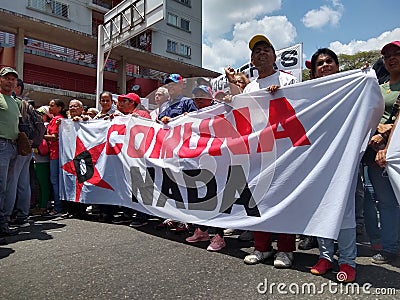 Supporters of Nicolas Maduro march in Caracas to commemorate the first anniversary of reelection Editorial Stock Photo