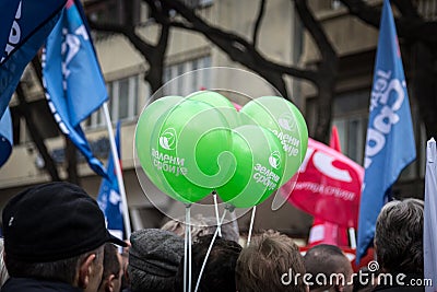 Supporters of the Serbian Green Party part cheering and waiving their green baloons in a political meeting. Editorial Stock Photo