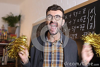 Supportive math teacher cheerleading with pompoms Stock Photo