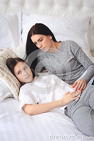 Supportive mother helping her worried teenage daughter Stock Photo