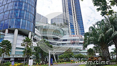 Four Point Hotel by Sheraton tower building in the PTC Pakuwon Trade Center mall with beautiful cloud sky background Editorial Stock Photo