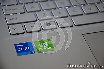 Surabaya, Indonesia - August 27, 2023: Intel Core i5 processor logo and Nvidia graphics card logo, Intel Core i5 sticker next to Editorial Stock Photo