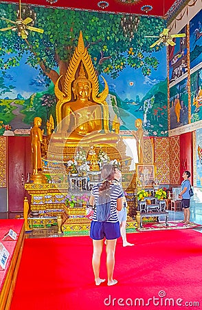 Golden buddha statue art paintings Wat Plai Laem temple Thailand Editorial Stock Photo