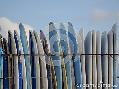 Surf boards stacked vertically Stock Photo