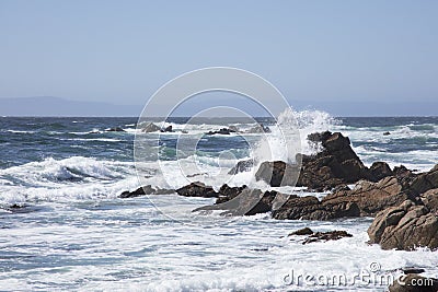 Surf Crashing along rocks along 17 mile drive California Stock Photo