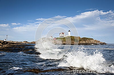 Surf Crashing by Nubble Lighthouse in Maine Stock Photo