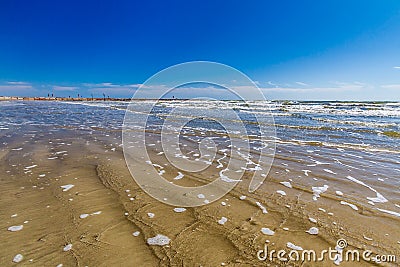 Surf Washing over The Sands of Galveston Beach Stock Photo