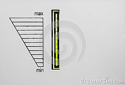 The surface of equipment with green led indicator and scale from min to max. Scale of load of alternating current AC Stock Photo