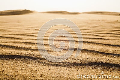 Surface level shot of the desert and the wind pattern on the sand Stock Photo