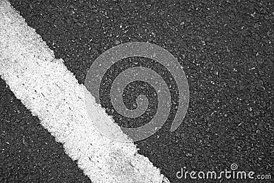 Surface rough and wet of asphalt after the rain, Grey with white line on the road and small rock, Texture Background Stock Photo