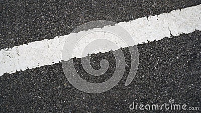 Surface rough and wet of asphalt after the rain, Grey with white line on the road and small rock, Texture Background, Top view. Stock Photo