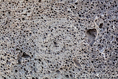 Surface of a volcanic rock with vesicular texture Stock Photo