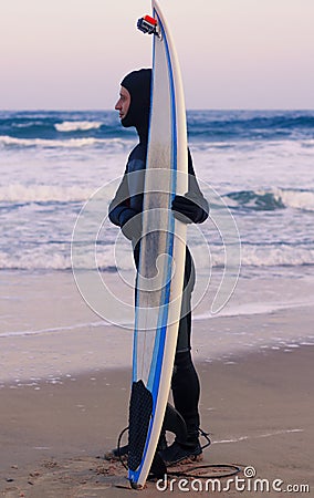 Surfboard with attached action camera on the sand Stock Photo