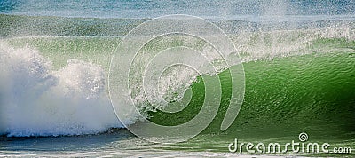 Surfer in a barrel falling under the force of the waves Stock Photo