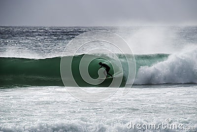 Surfer in a barrel Editorial Stock Photo