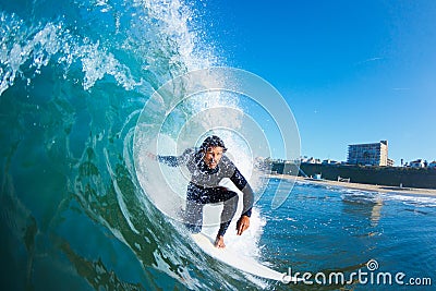 Surfer On Blue Ocean Wave Stock Photo