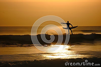 Surfer on Blue Ocean Wave Getting Barreled at Sunrise. Neural network AI generated Stock Photo