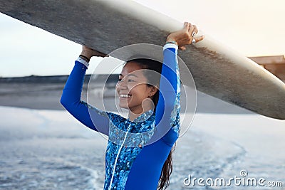 Surfer Girl. Surfing Woman Holding White Surfboard On Head. Smiling Brunette In Blue Wetsuit Going To Surf In Ocean. Stock Photo