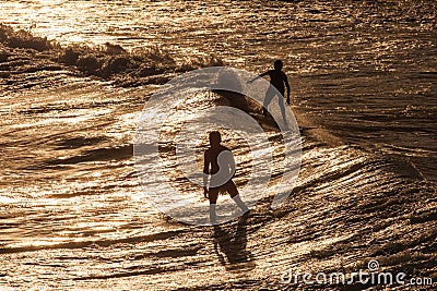 Surfer Rides a Large Blue Tropical Wave in Paradise Stock Photo