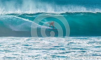 Surfer riding big wave Stock Photo