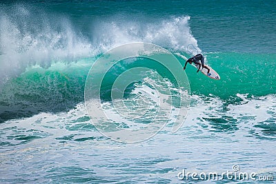 Surfer riding big wave Stock Photo