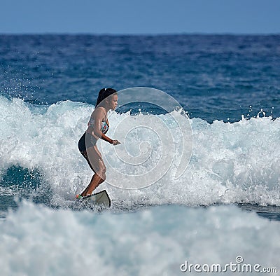 Surfer school. Beautiful young woman in swimsuit. Surfer on the wave. beautiful ocean wave. Water sport activity Editorial Stock Photo