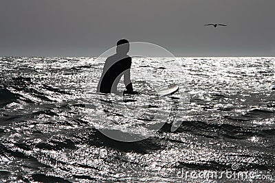 Surfer at sea Stock Photo