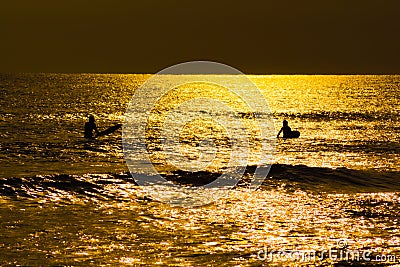 Surfer silhouette and dusk of Kamakura coast Stock Photo