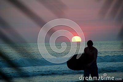 Surfer at Sunset Stock Photo