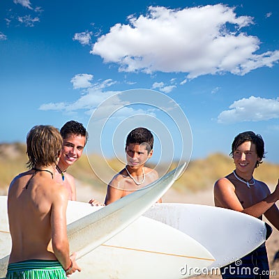 Surfer teen boys talking on beach shore Stock Photo