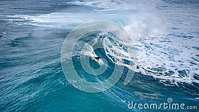 A Surfer About to Catch a Huge Wave at Sunset Beach, Hawaii Stock Photo