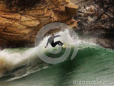 Surfer on a wave Editorial Stock Photo