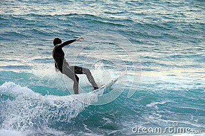 Surfer on a wave Editorial Stock Photo