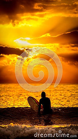 Surfer sunset wallpaper Stock Photo