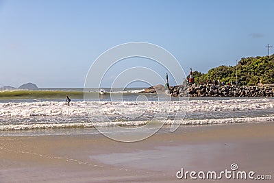 Surfers at Beach of Barra da Lagoa area of Lagoa da Conceicao - Florianopolis, Santa Catarina, Brazil Editorial Stock Photo