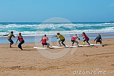 Surfers getting surfing lessons at Praia Vale Figueiras in Portugal Editorial Stock Photo