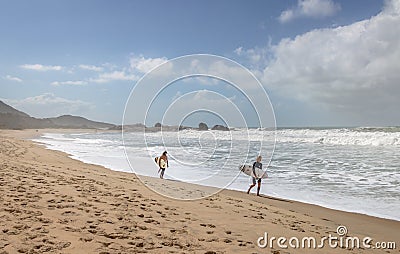 Surfers at Praia Mole Mole Beach - Florianopolis, Santa Catarina, Brazil Editorial Stock Photo