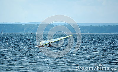 Surfers swimming on boards on the Puck Bay in poland on a warm summer day Editorial Stock Photo