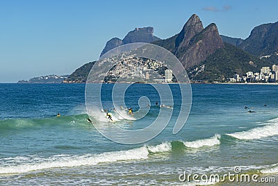 Surfers waiting for the perfect wave. Wonderful places in the world for s Editorial Stock Photo