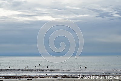 Surfers waiting for a wave Stock Photo