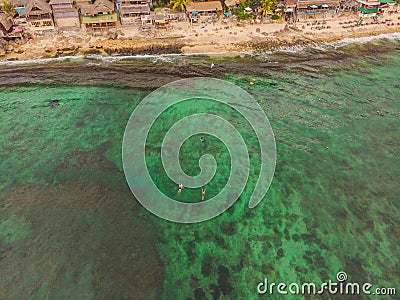 Surfers on the waves in the ocean, top view Editorial Stock Photo