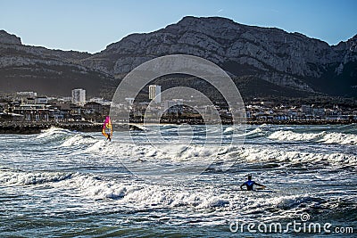 Surfers and windsurfers in action Editorial Stock Photo