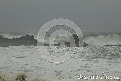 Surfing the waves on the beach of Matosinhos Stock Photo