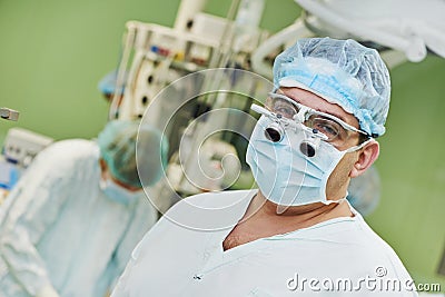 Surgeon doctor in surgery operation room Stock Photo